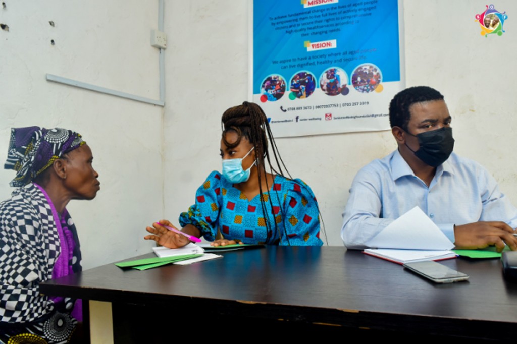 Our Medical Team having a health related discussion with the beneficiary (The medical team is led by Dr. Oni)